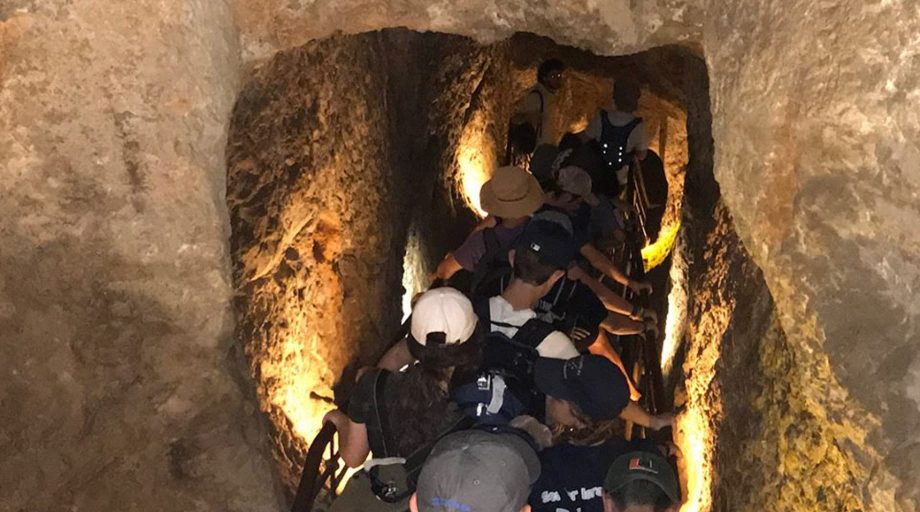 Students exploring Israeli caves