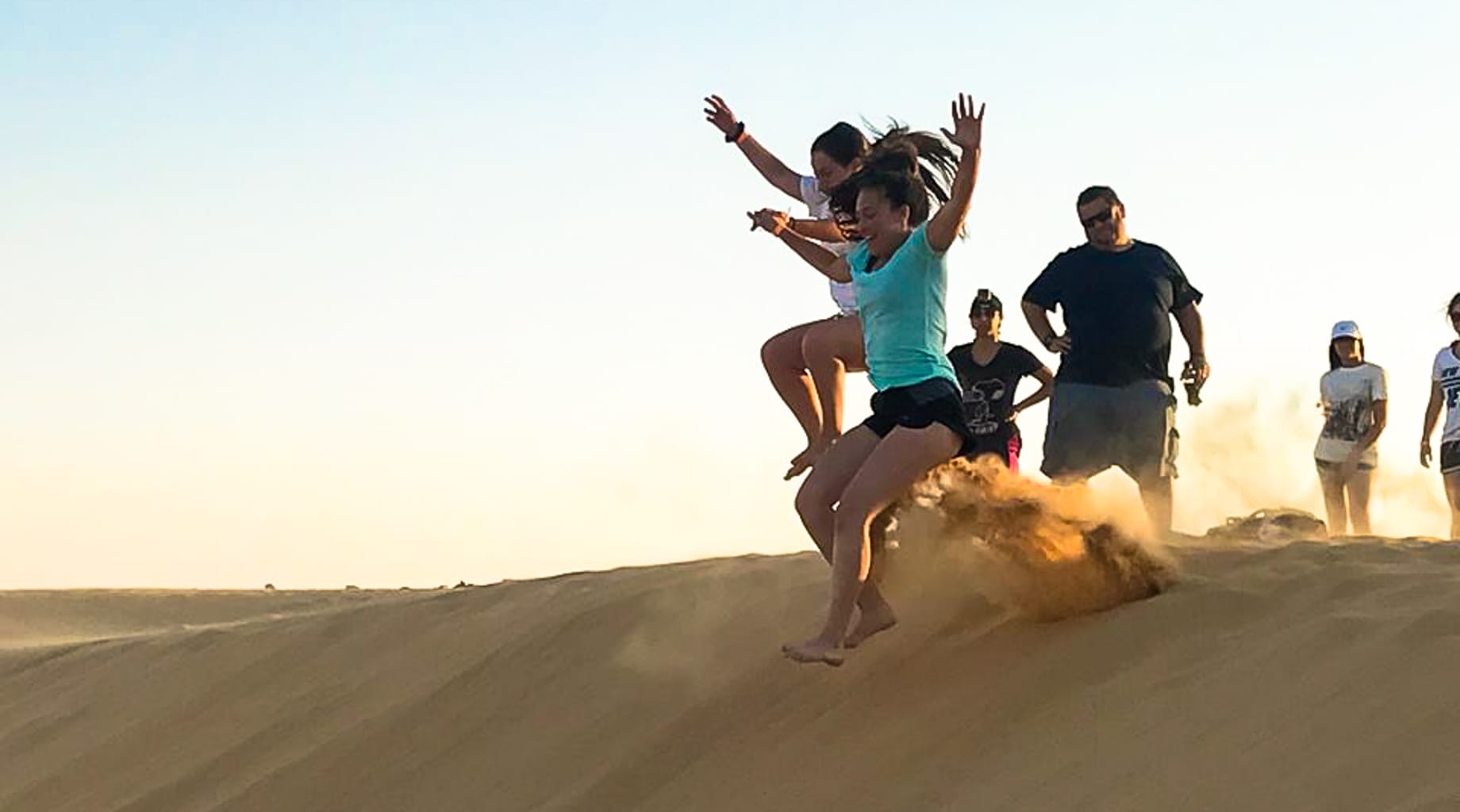 Jumping off sand dunes in Israel