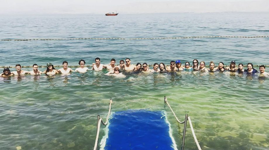Group of student swimming in ocean in Israel