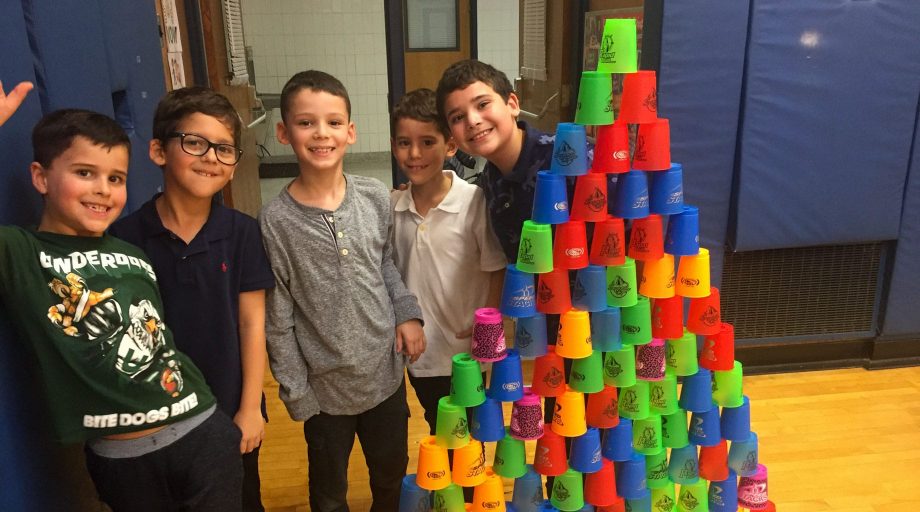Lower school boys stacking cups